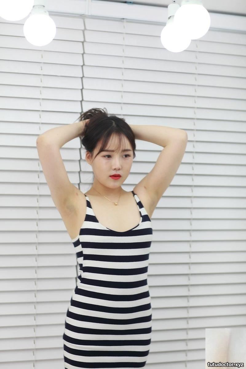 Large-scale photo of a half-shy fair young woman model · photo 2 of 39