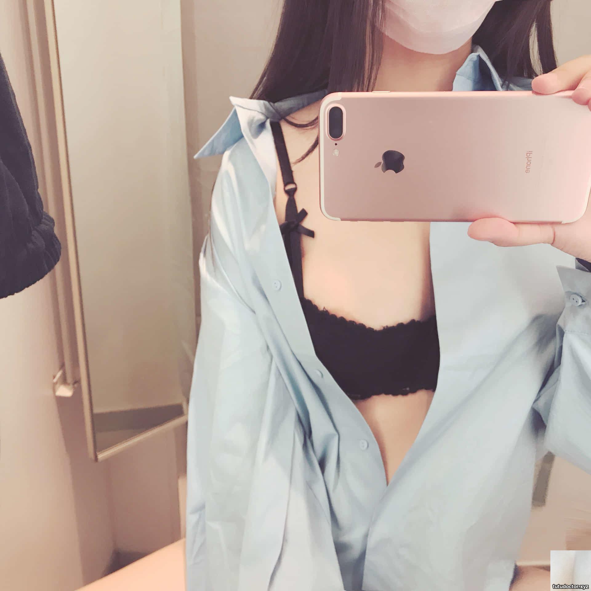 So bold! A sexy girl takes a selfie with her breasts exposed in · photo 8 of 22