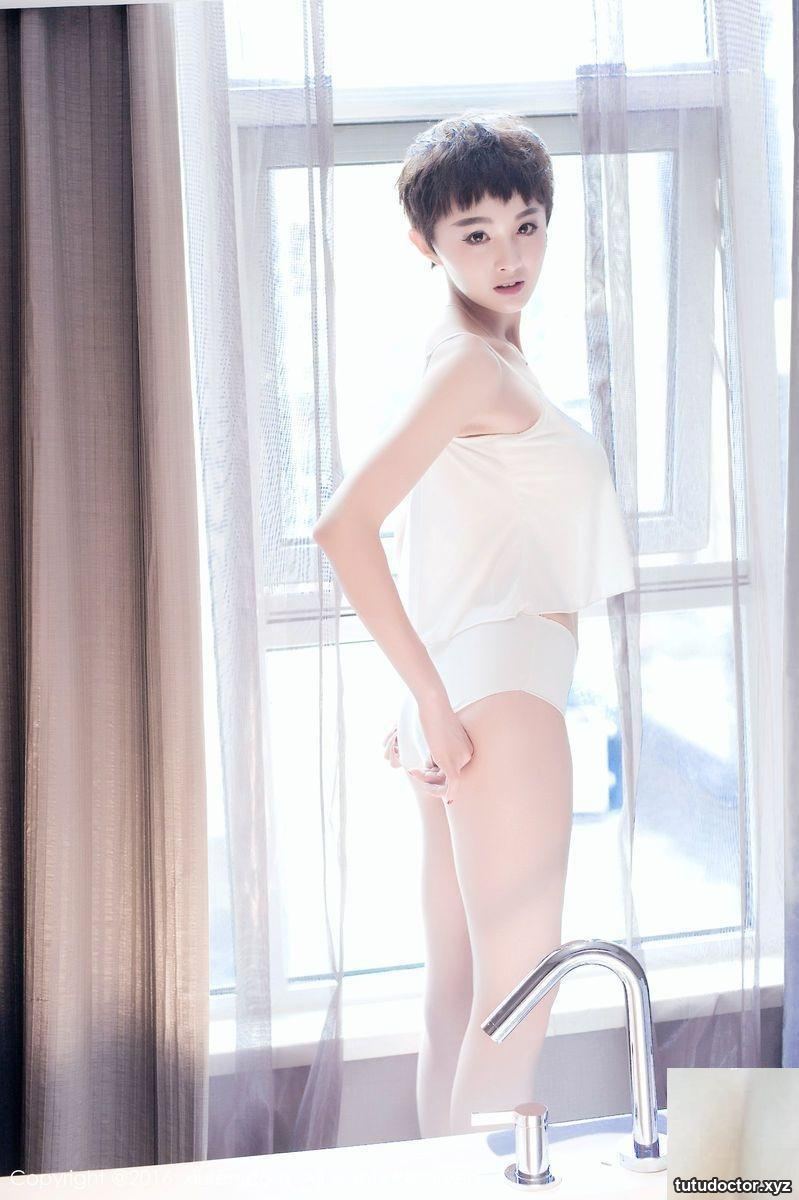 Short-haired beauty stewardess babykiki in white shirt gets wet · photo 12 of 19